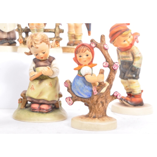 159 - Goebel - A collection of West German Goebel porcelain china figurines. Depicting young children, pla... 