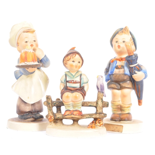 159 - Goebel - A collection of West German Goebel porcelain china figurines. Depicting young children, pla... 