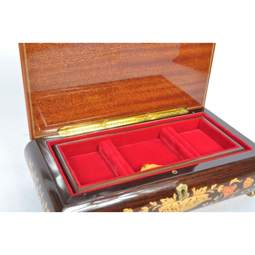 169 - A collection of three vintage 20th century wooden jewellery musical boxes. Including a polyphon with... 