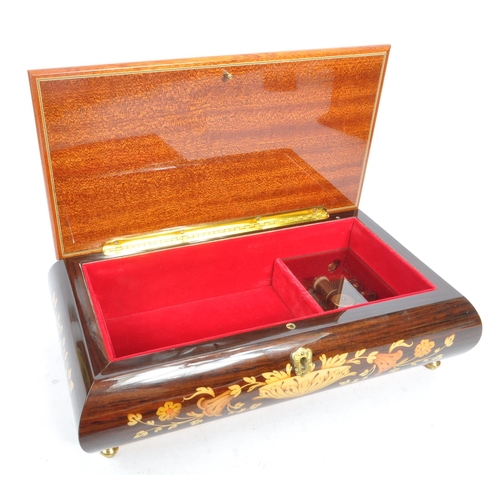 169 - A collection of three vintage 20th century wooden jewellery musical boxes. Including a polyphon with... 