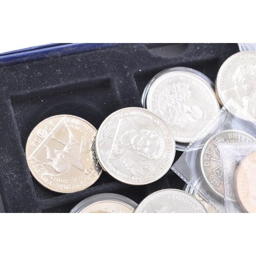 174 - A collection of 20th and 21st century British commemorative coins, to include the overseas territori... 