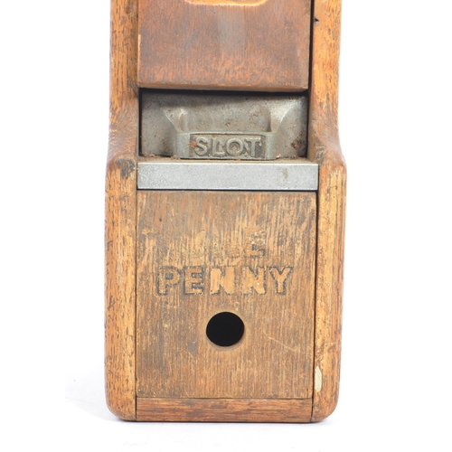 187 - An original early 20th century oak wood wall mounted match dispenser. With internal aluminium casing... 