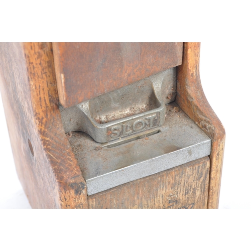 187 - An original early 20th century oak wood wall mounted match dispenser. With internal aluminium casing... 