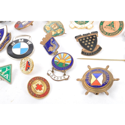 197 - A collection of vintage 20th century enamelled brand / cooperation / group badges. Some examples inc... 