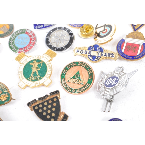 197 - A collection of vintage 20th century enamelled brand / cooperation / group badges. Some examples inc... 