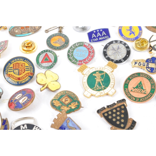 197 - A collection of vintage 20th century enamelled brand / cooperation / group badges. Some examples inc... 