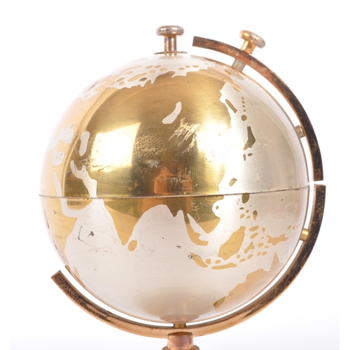 201 - A mid 20th century circa 1960s metal cigarette dispenser in the form of a world globe. The dispenser... 