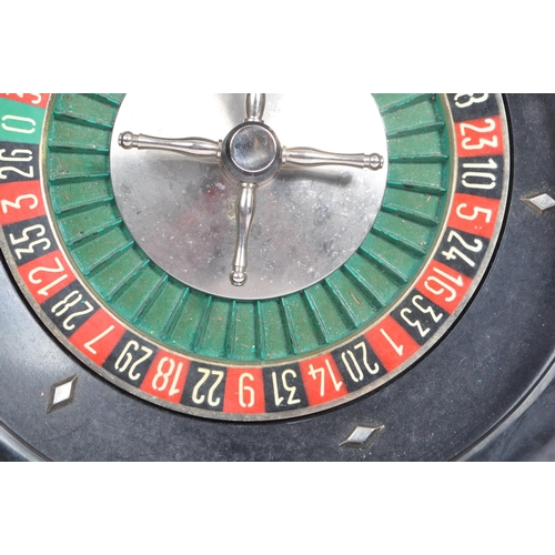 213 - A vintage mid 20th century circa 1950s French Monte-Carlo style table top roulette spinning wheel. T... 