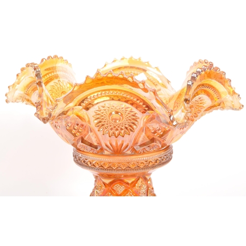 22 - A vintage iridescent carnival glass punch bowl in a marigold / amber colourway. Measures 28.5cm (dia... 