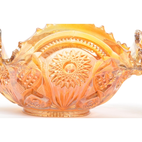 22 - A vintage iridescent carnival glass punch bowl in a marigold / amber colourway. Measures 28.5cm (dia... 