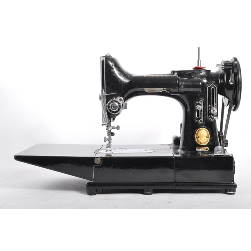 224 - A vintage 20th century Singer Featherweight convertible portable sewing machine model number 222k co... 