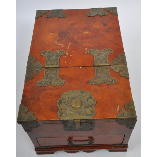 227 - A 20th century hardwood and brass Chinese casket - jewellery box. Of rectangular form with articulat... 