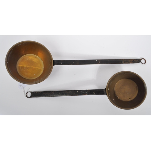 234 - A collection of 19th century Victorian copper and brass graduating saucepans. Varying sizes with bra... 