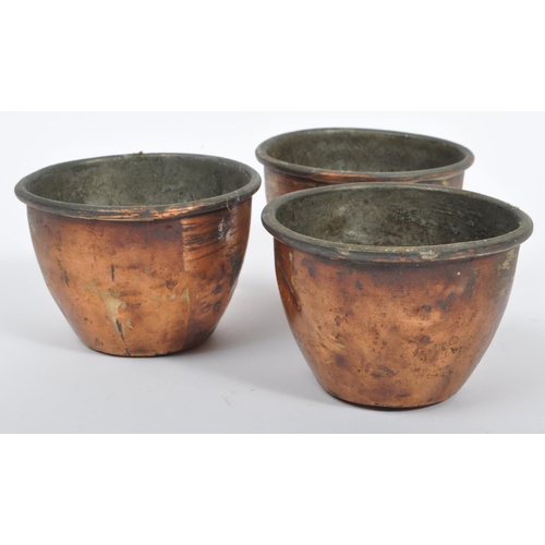 234 - A collection of 19th century Victorian copper and brass graduating saucepans. Varying sizes with bra... 