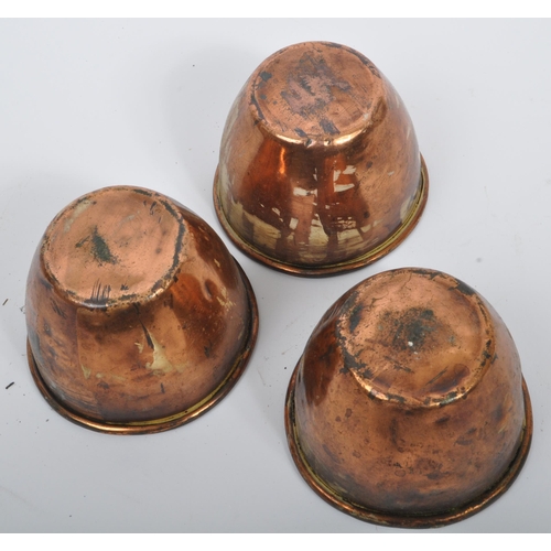 234 - A collection of 19th century Victorian copper and brass graduating saucepans. Varying sizes with bra... 