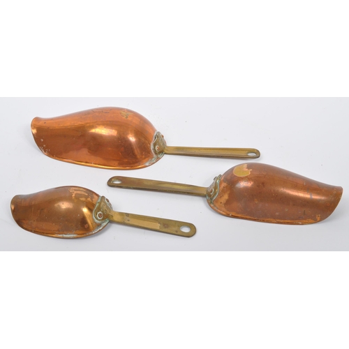 234 - A collection of 19th century Victorian copper and brass graduating saucepans. Varying sizes with bra... 