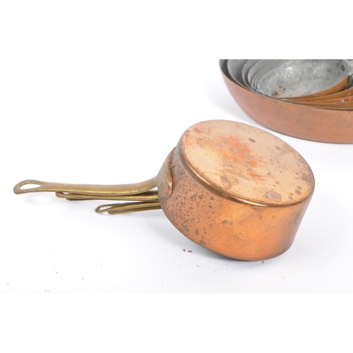 236 - A collection of 19th century Victorian copper and brass graduating frying pans. Varying sizes with b... 