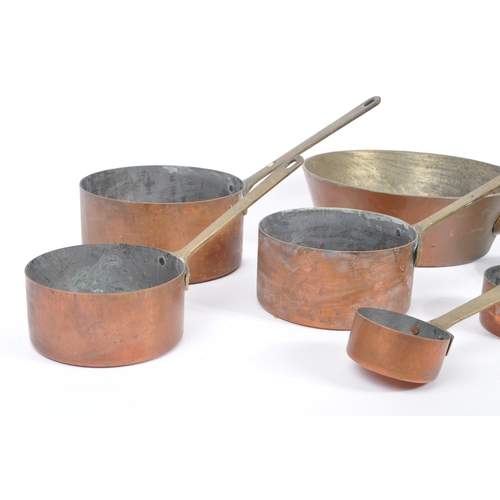 238 - A collection of 19th century Victorian copper and brass graduating saucepans. Varying sizes with bra... 