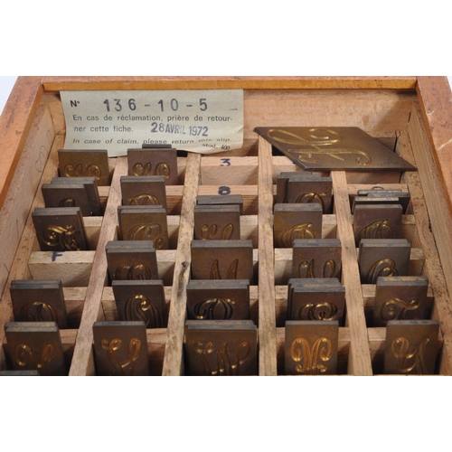 241 - A vintage 20th century circa 1970s boxed Gravograph set containing a quantity of brass letter templa... 