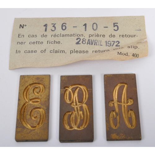 241 - A vintage 20th century circa 1970s boxed Gravograph set containing a quantity of brass letter templa... 