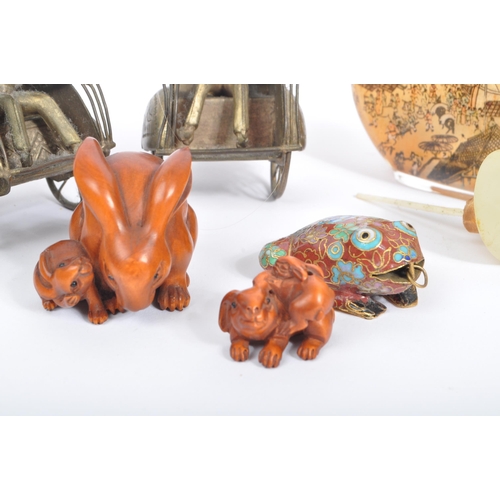 244 - A collection of 20th century Chinese curios to include an enamelled cloisonne frog pendant, a Chines... 