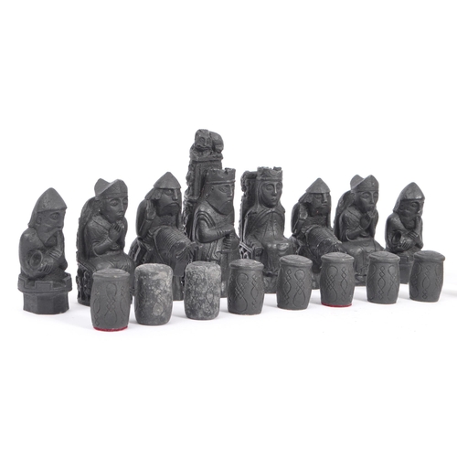 248 - The Lewis Chessmen - A full set of 20th century resin Isle of Lewis Chessmen chess pieces. Modelled ... 