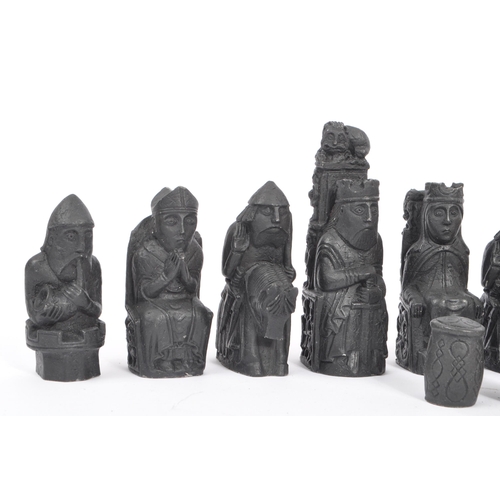 248 - The Lewis Chessmen - A full set of 20th century resin Isle of Lewis Chessmen chess pieces. Modelled ... 