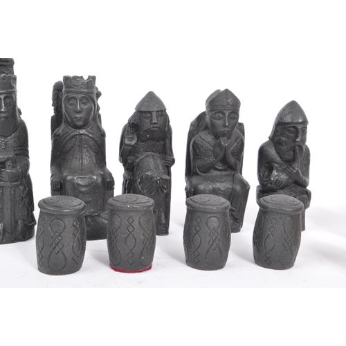 248 - The Lewis Chessmen - A full set of 20th century resin Isle of Lewis Chessmen chess pieces. Modelled ... 