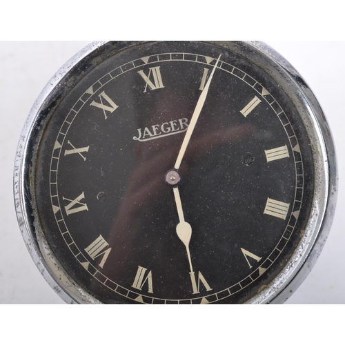 249 - Jaeger - A vintage chrome Jaeger car clock face having black face with white roman numeral to chapte... 