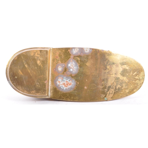 250 - A large 20th Century Indian Benares enamelled brass ashtray in the form of a shoe. The ashtray havin... 