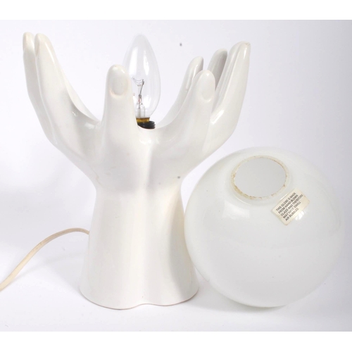 257 - A vintage 1980S table lamps / lights. In the form of two hands by Phoenix. A white ceramic / porcela... 