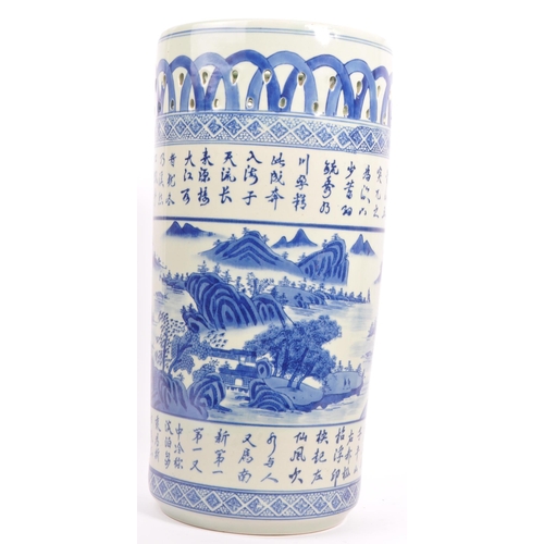 26 - A 20th century Chinese hand painted porcelain blue and white umbrella stick stand. The umbrella stan... 