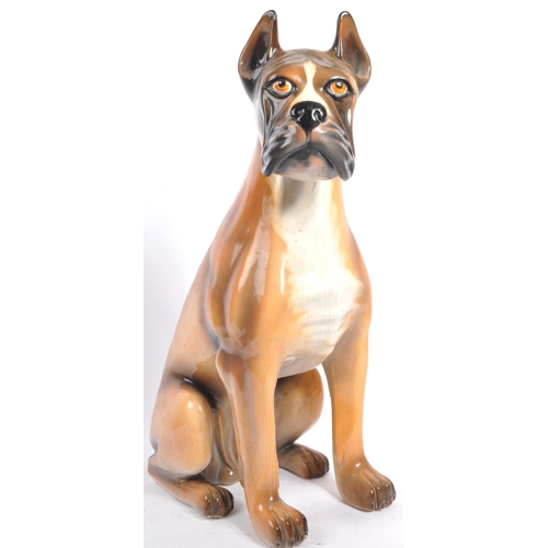 27 - A large vintage circa 1970s Italian ceramic boxer dog figurine. Modelled seated with hand painted fe... 