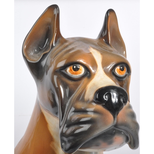 27 - A large vintage circa 1970s Italian ceramic boxer dog figurine. Modelled seated with hand painted fe... 