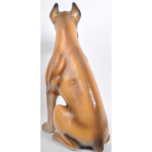 27 - A large vintage circa 1970s Italian ceramic boxer dog figurine. Modelled seated with hand painted fe... 