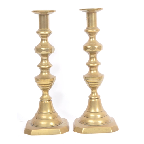 275 - A collection of late 19th / early 20th century brass candlesticks and jam pot. To include three matc... 