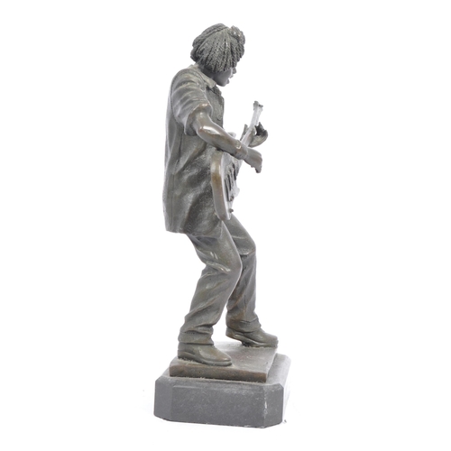 283 - Vintage 20th century bronze figure of a bass guitar player. With afro hair in a standing position pl... 