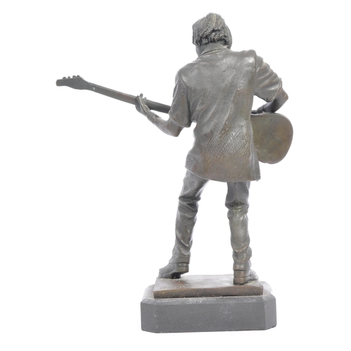 283 - Vintage 20th century bronze figure of a bass guitar player. With afro hair in a standing position pl... 