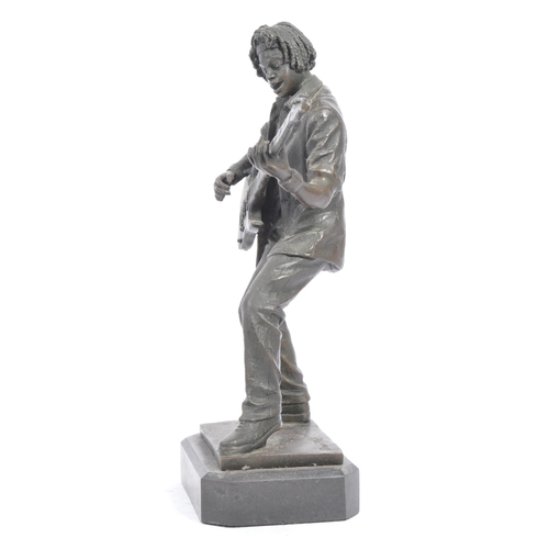 283 - Vintage 20th century bronze figure of a bass guitar player. With afro hair in a standing position pl... 