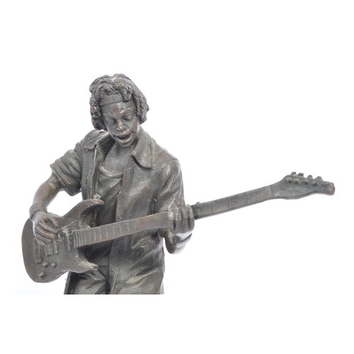 283 - Vintage 20th century bronze figure of a bass guitar player. With afro hair in a standing position pl... 