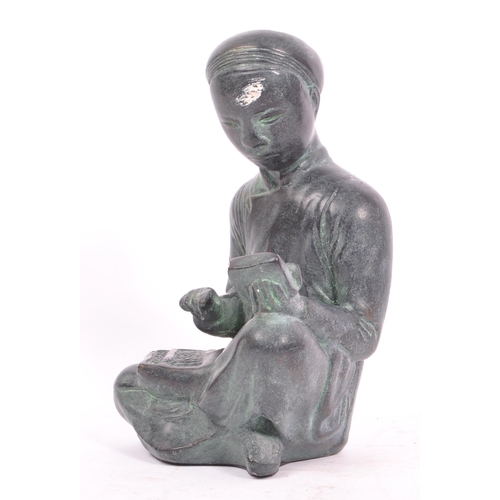 284 - A 20th century circa. 1960s Austin bronzed plaster sculpture modelled in the form of a seated Chines... 