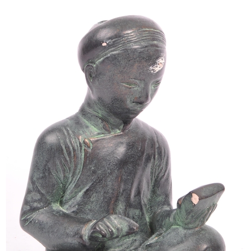 284 - A 20th century circa. 1960s Austin bronzed plaster sculpture modelled in the form of a seated Chines... 