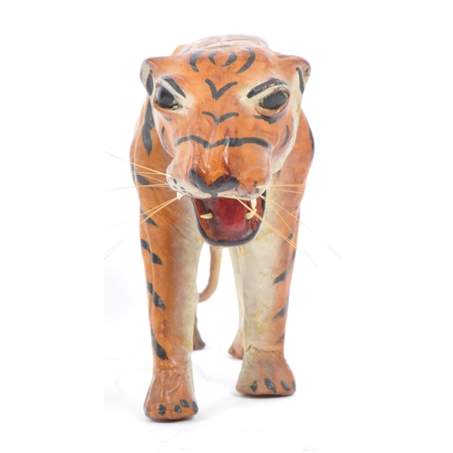 286 - A 20th century circa 1960s painted leather papier mache French tiger figure. The figure being modell... 