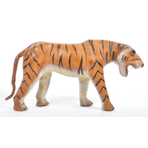 286 - A 20th century circa 1960s painted leather papier mache French tiger figure. The figure being modell... 