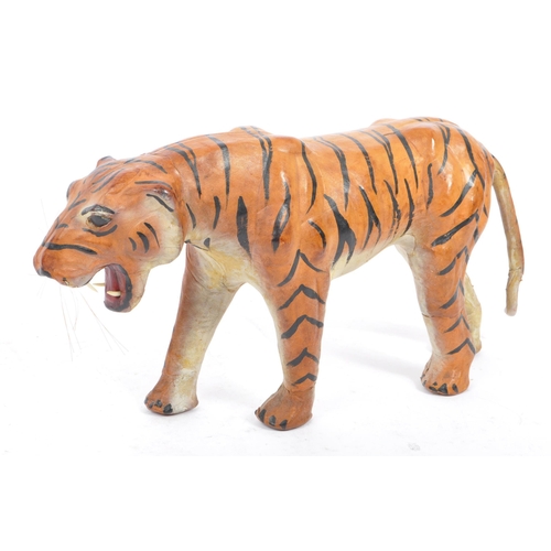 286 - A 20th century circa 1960s painted leather papier mache French tiger figure. The figure being modell... 