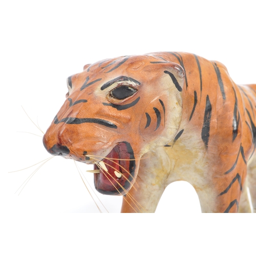 286 - A 20th century circa 1960s painted leather papier mache French tiger figure. The figure being modell... 