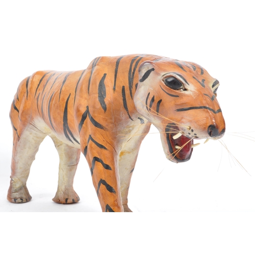 286 - A 20th century circa 1960s painted leather papier mache French tiger figure. The figure being modell... 