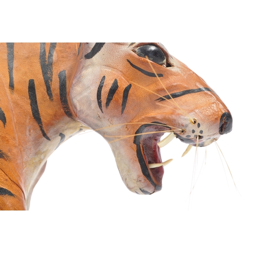 286 - A 20th century circa 1960s painted leather papier mache French tiger figure. The figure being modell... 