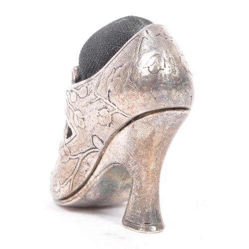 287 - An early 20th century English silver plated novelty pin cushion modelled in the form of a Georgian b... 