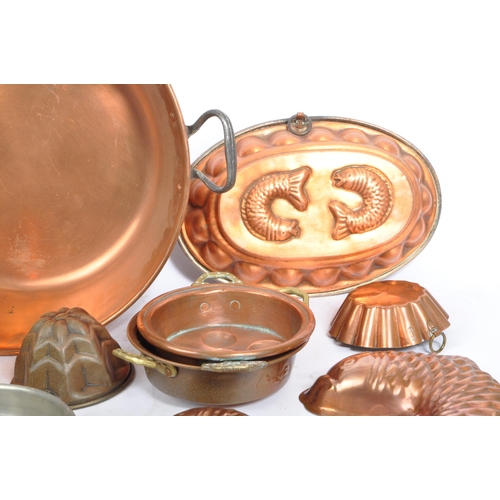 294 - A collection of early to mid 20th century brass / copper items. Including various size jelly moulds ... 